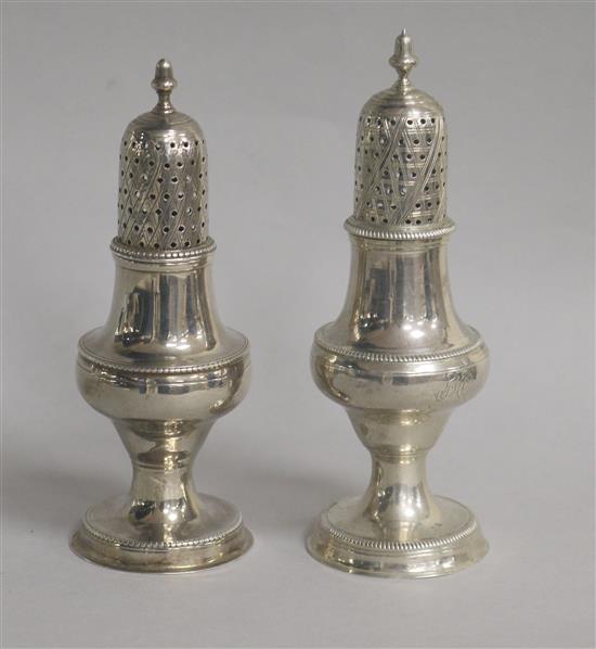A George III silver pedestal pepperette by Hester Bateman, London, 1784 and one other pepperette, London, 1782, tallest 14cm